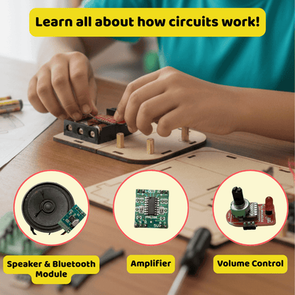 Children's hands working with electronic components on a wooden board, with illustrations of a speaker, amplifier, and volume control.