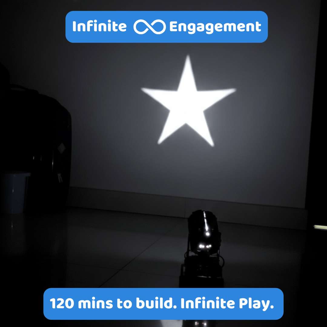 Star projection on a wall with 'Infinite Engagement' branding and text about build time.