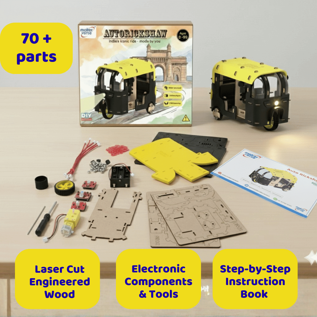 Model kit of an auto-rickshaw with packaging, parts, and tools on a table.